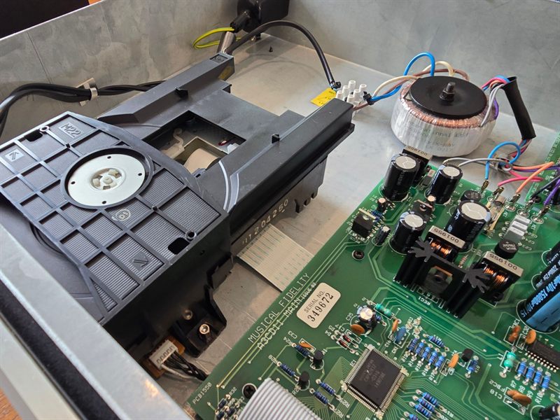 Angled view of Sony CD loading mechanism, toroidal transformer and Musical Fidelity main PCB inside the A3.2 chassis